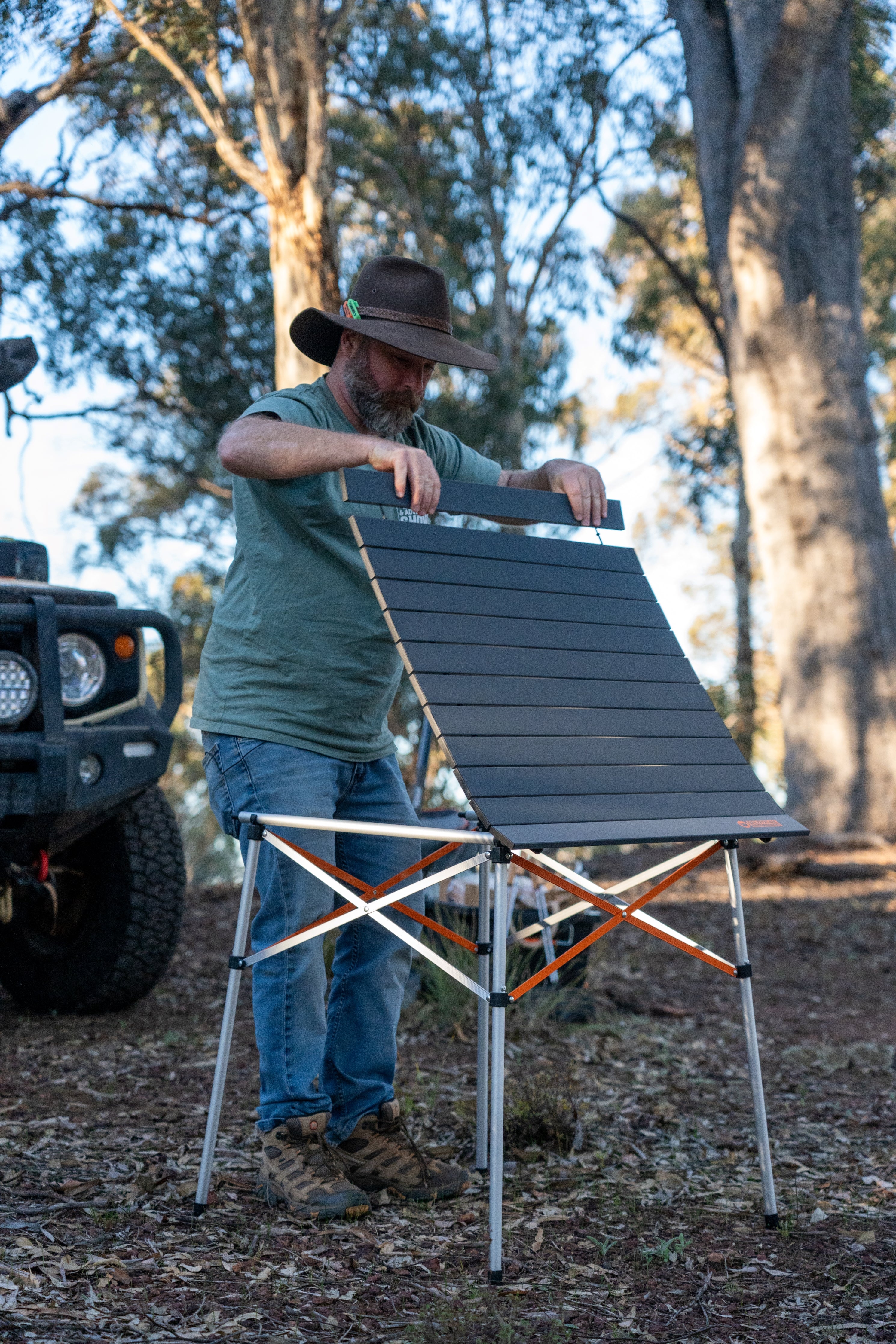 Wildtrak™ 70cm Camp Table, Foldable Frame & Tabletop, Tension Bars, Lightweight Coated Aluminum, Weight Rated 30kg, Carry Bag with Shoulder Strap