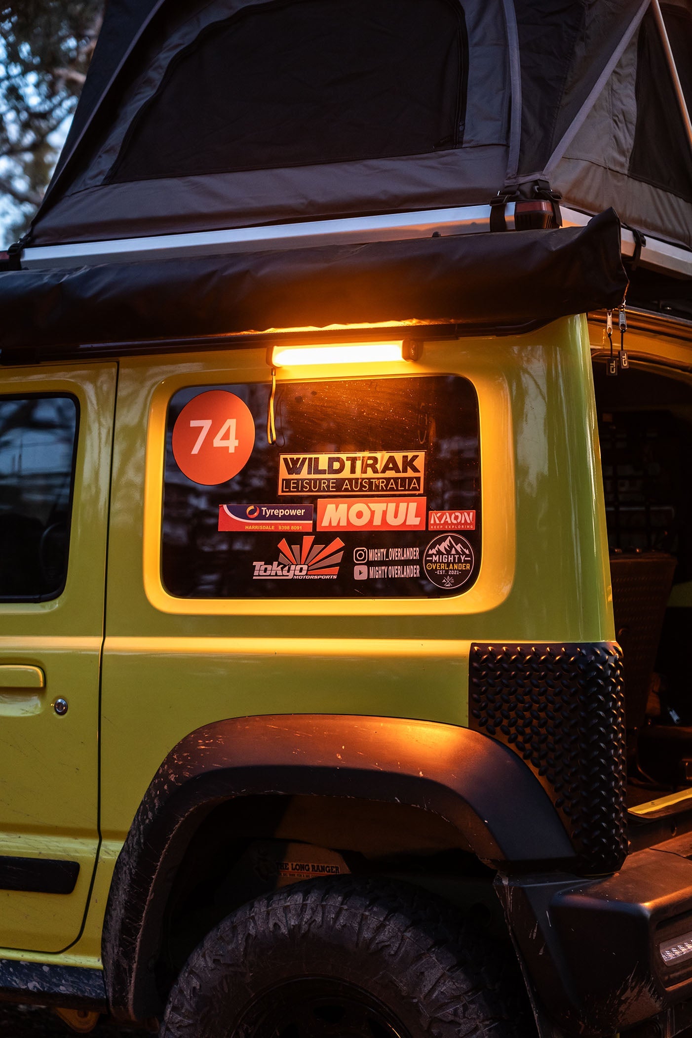 Wildtrak Base 300 Multi Light illuminating campsite outdoors